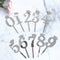 ASSORTED METALIC GOLD / SILVER 0-9 CAKE TOPPERS. JL1247